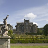 A view past the statue of David slaying Goliath and the Rose Garden at Seaton Delaval Hall, Northumberland
